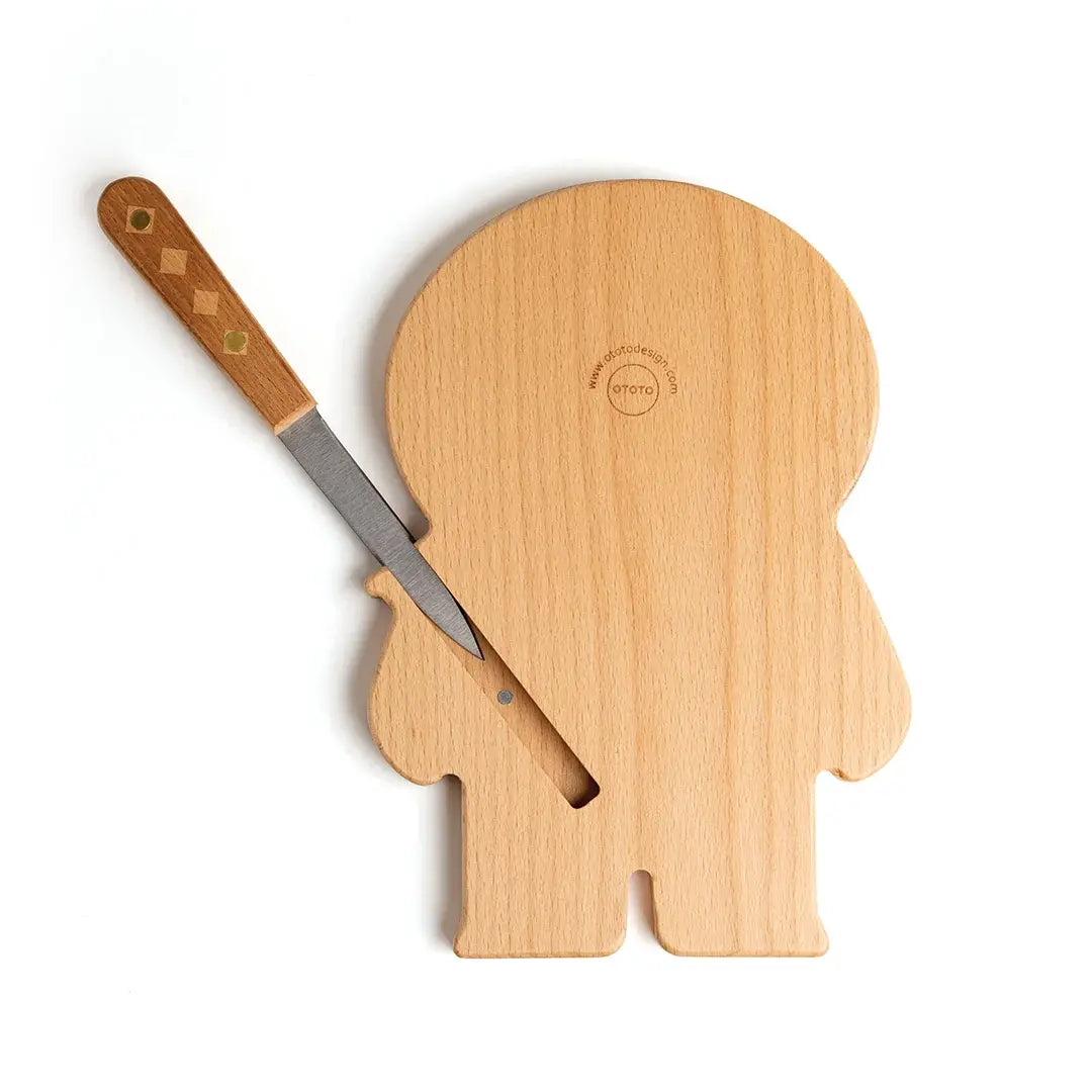 a knife stuck in a cutting board