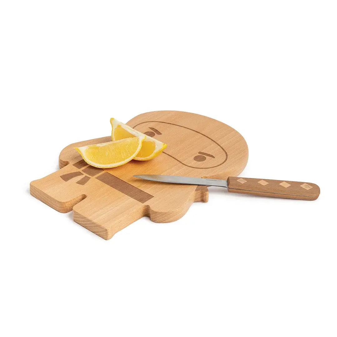 a cutting board with a knife and lemon wedges on it