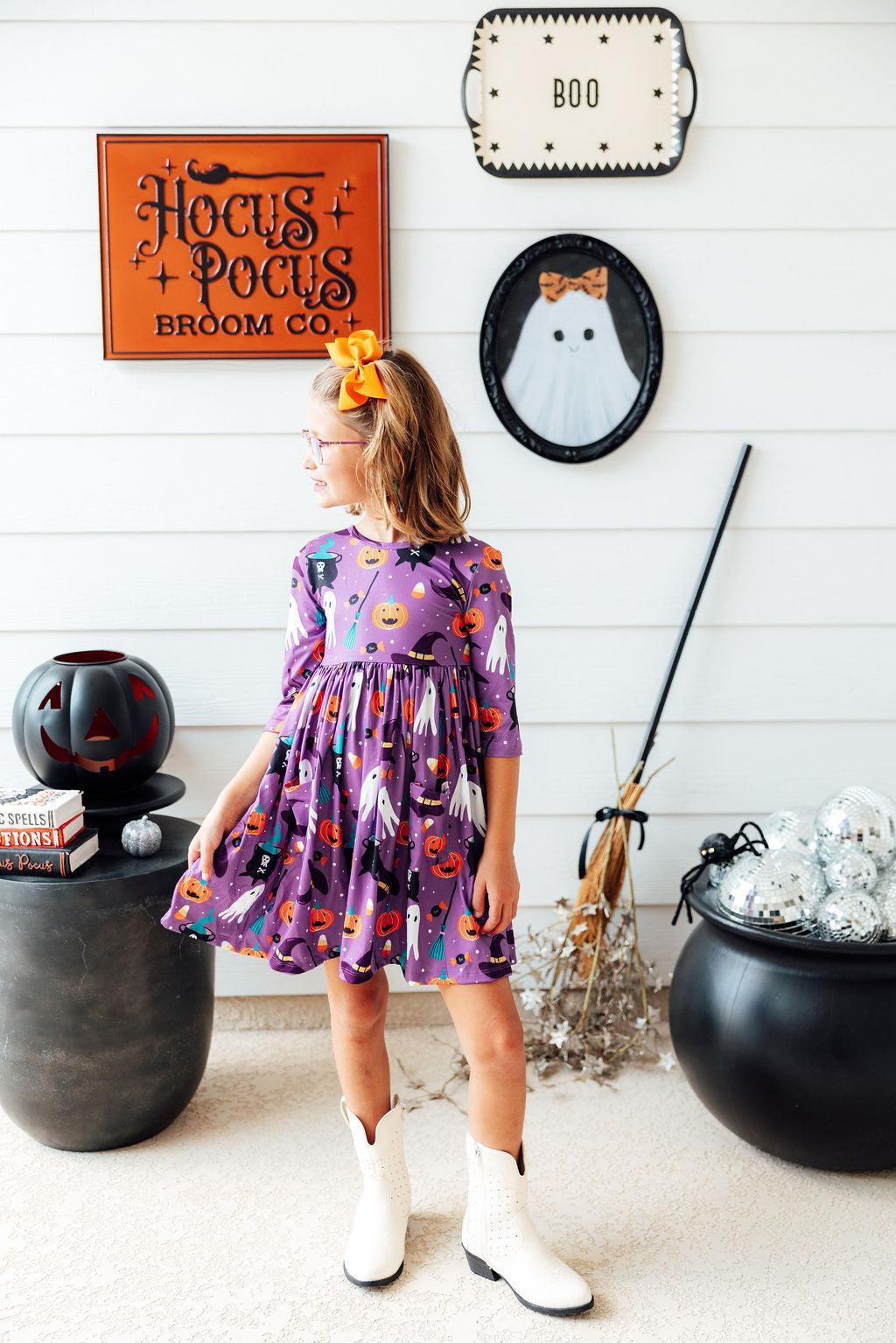 a girl in a purple dress