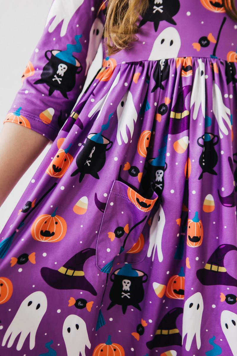 a purple dress with halloween design