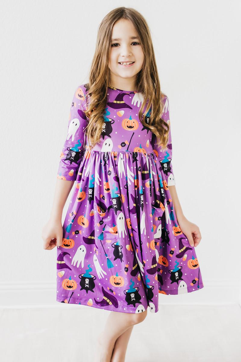 a girl in a purple dress