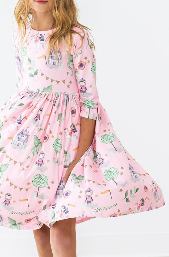 a girl wearing a pink dress