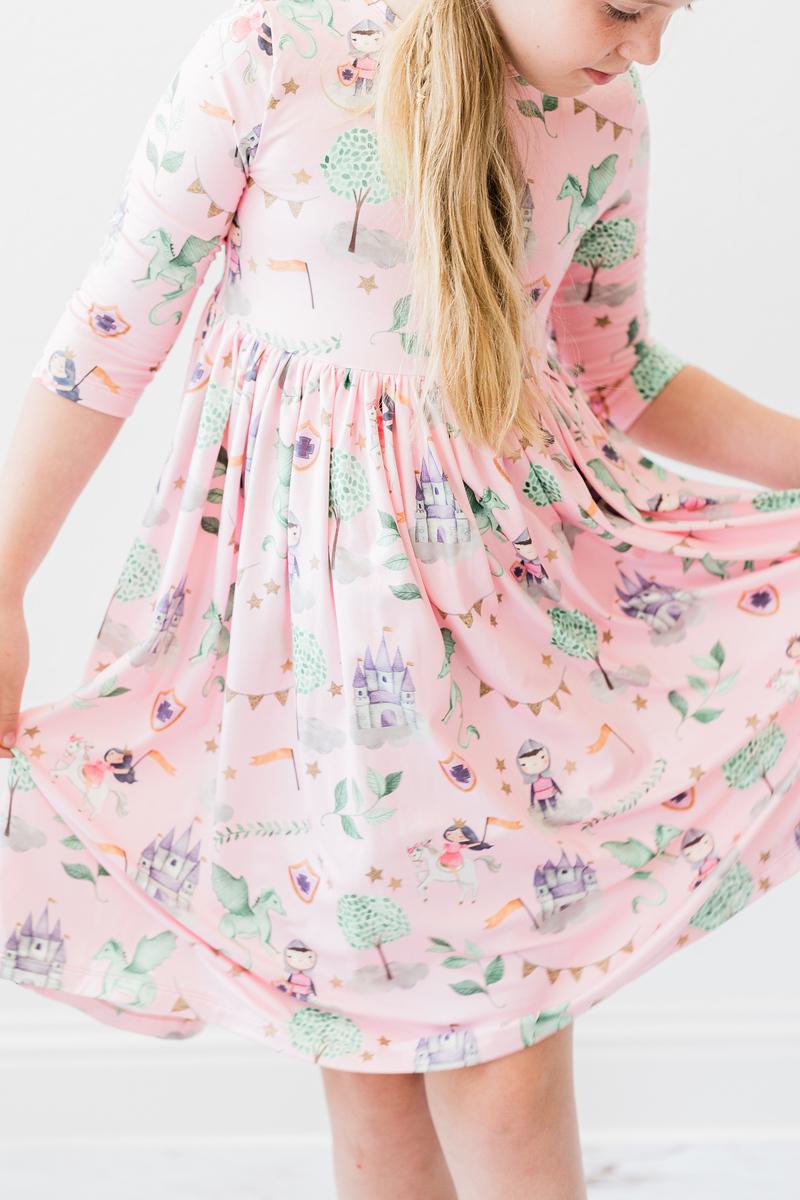 a girl wearing a pink dress