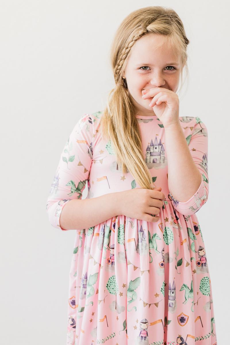 a girl in a pink dress