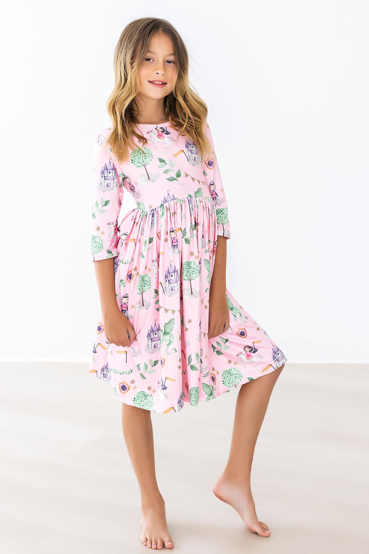 a girl in a pink dress