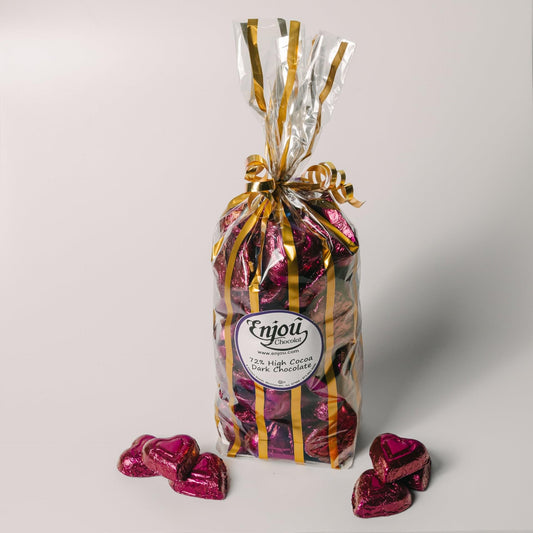 a bag of chocolates and chocolate hearts