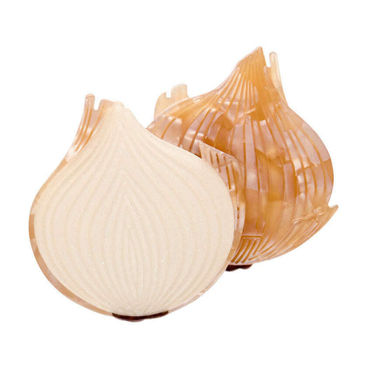 a cut up onion on a white background