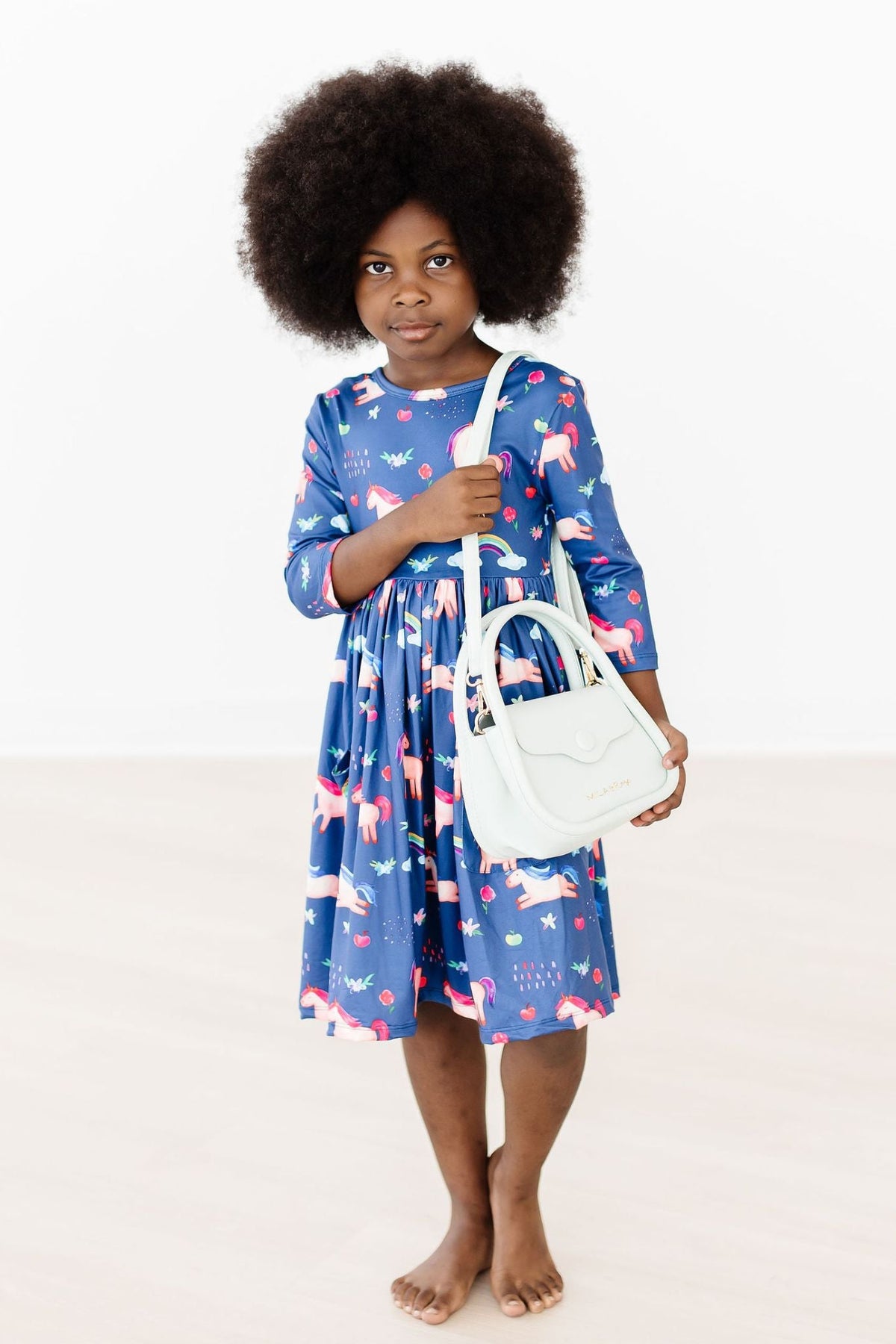 a girl holding a purse