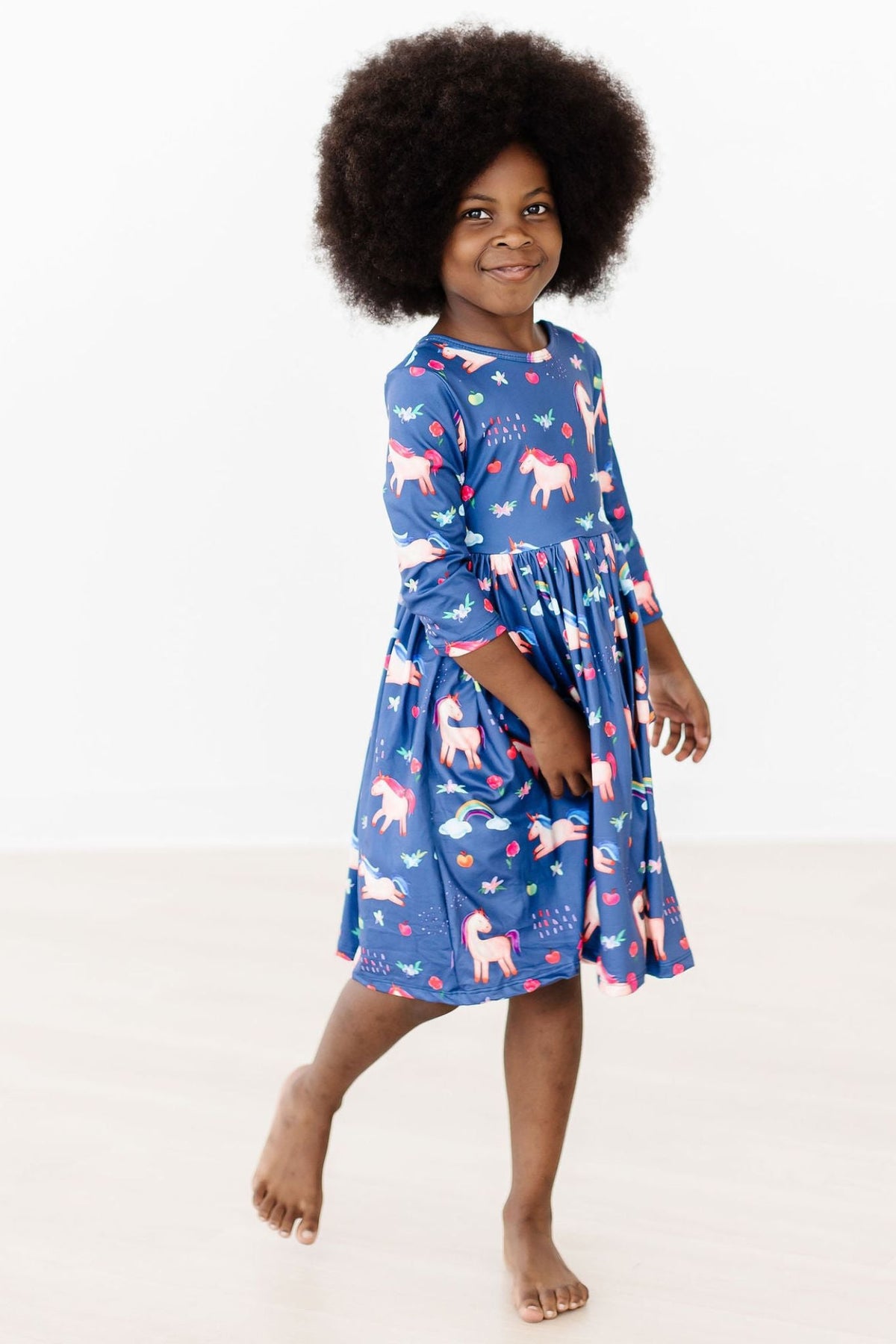 a girl in a blue dress