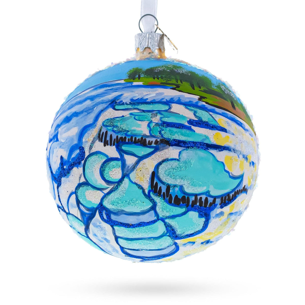 a blue and white ornament with a painting on it
