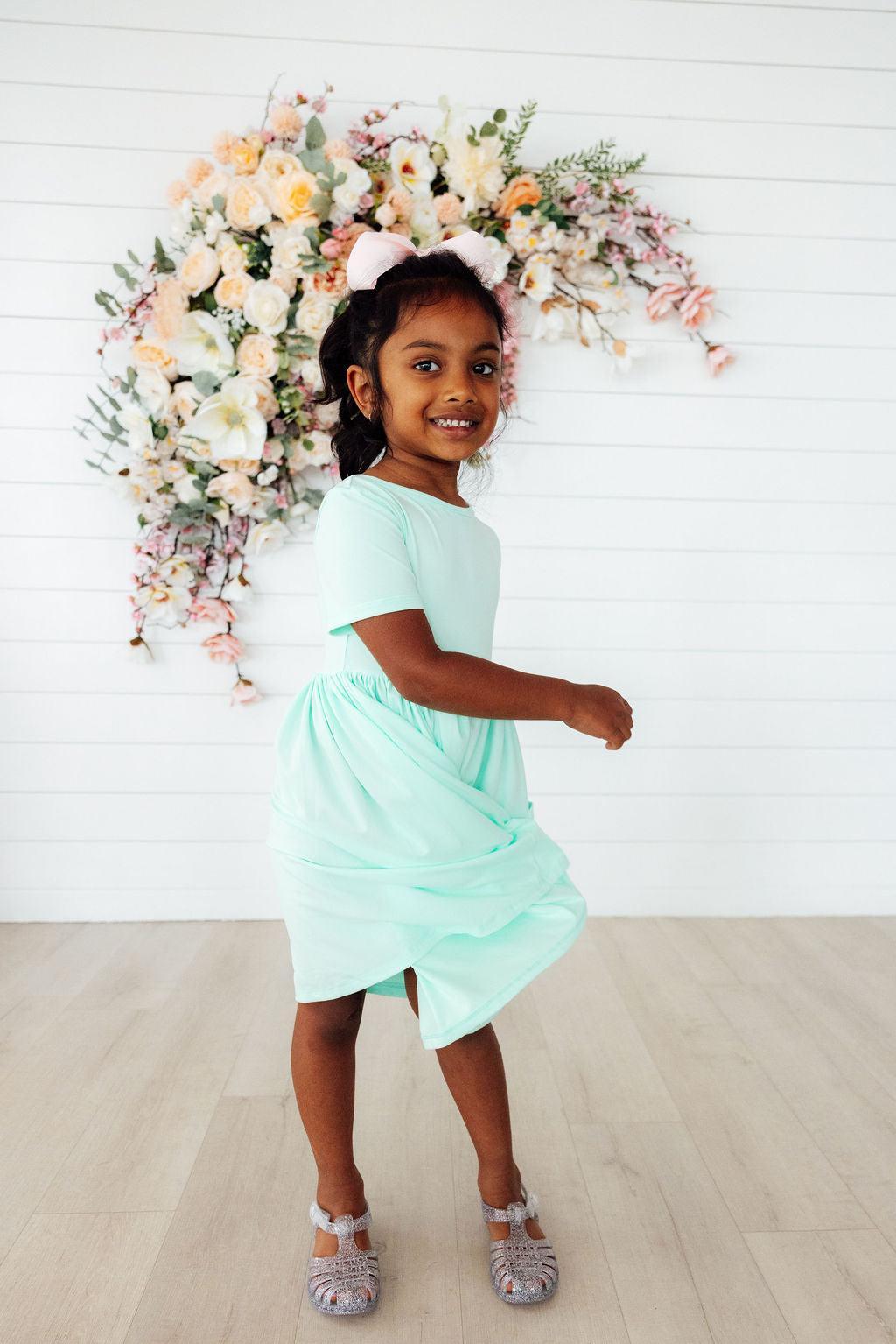 a girl in a dress