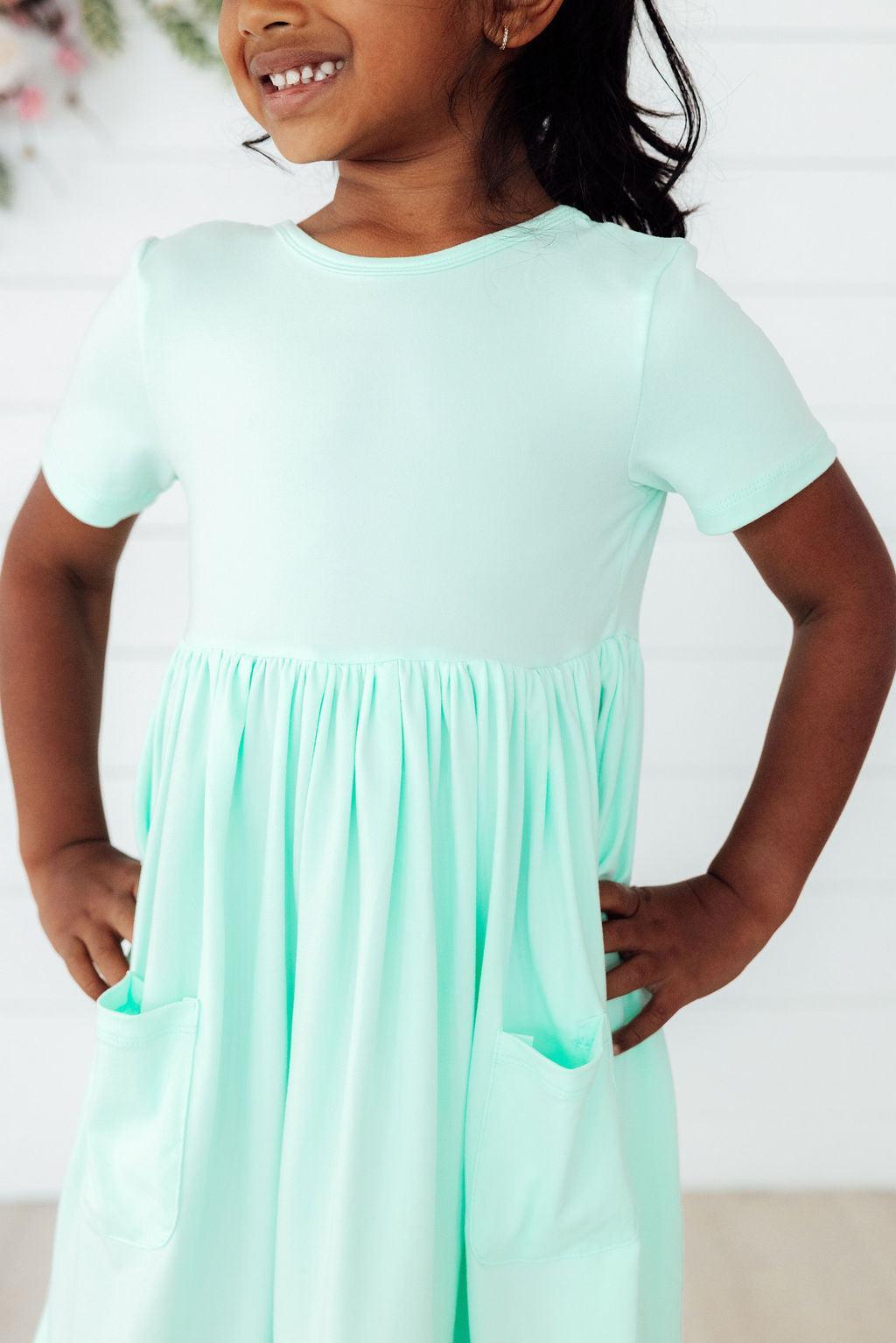 a girl in a light blue dress