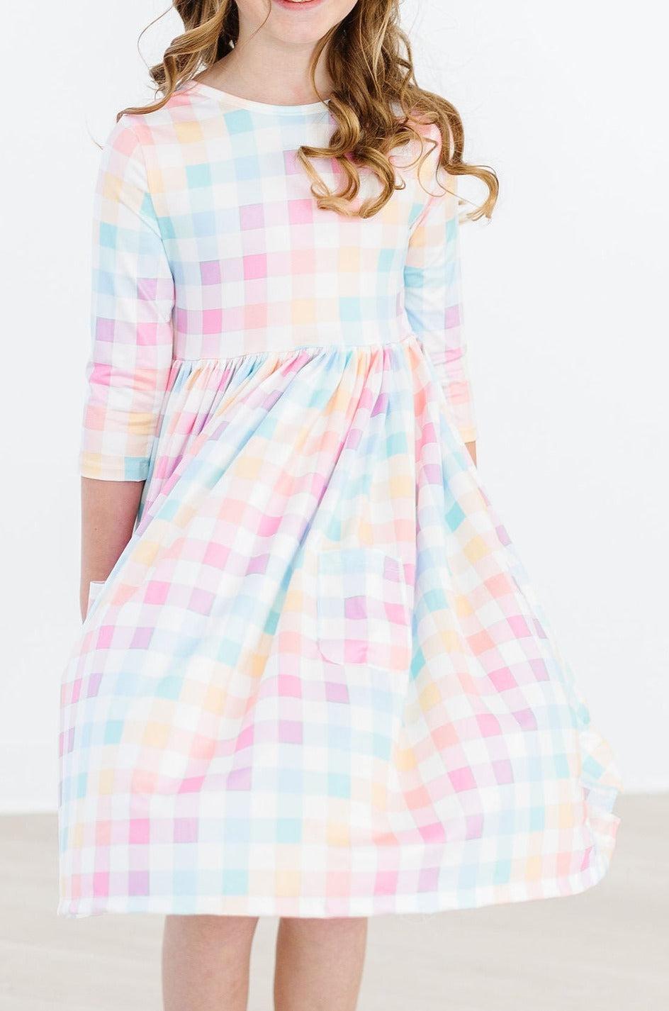 a girl in a plaid dress