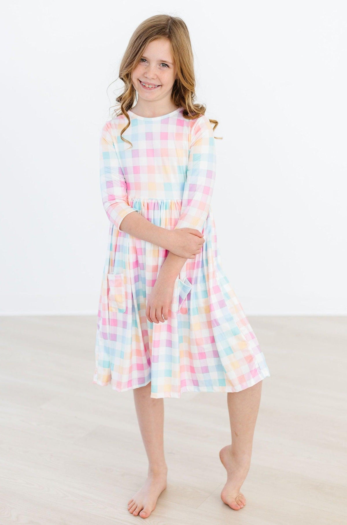 a girl in a plaid dress