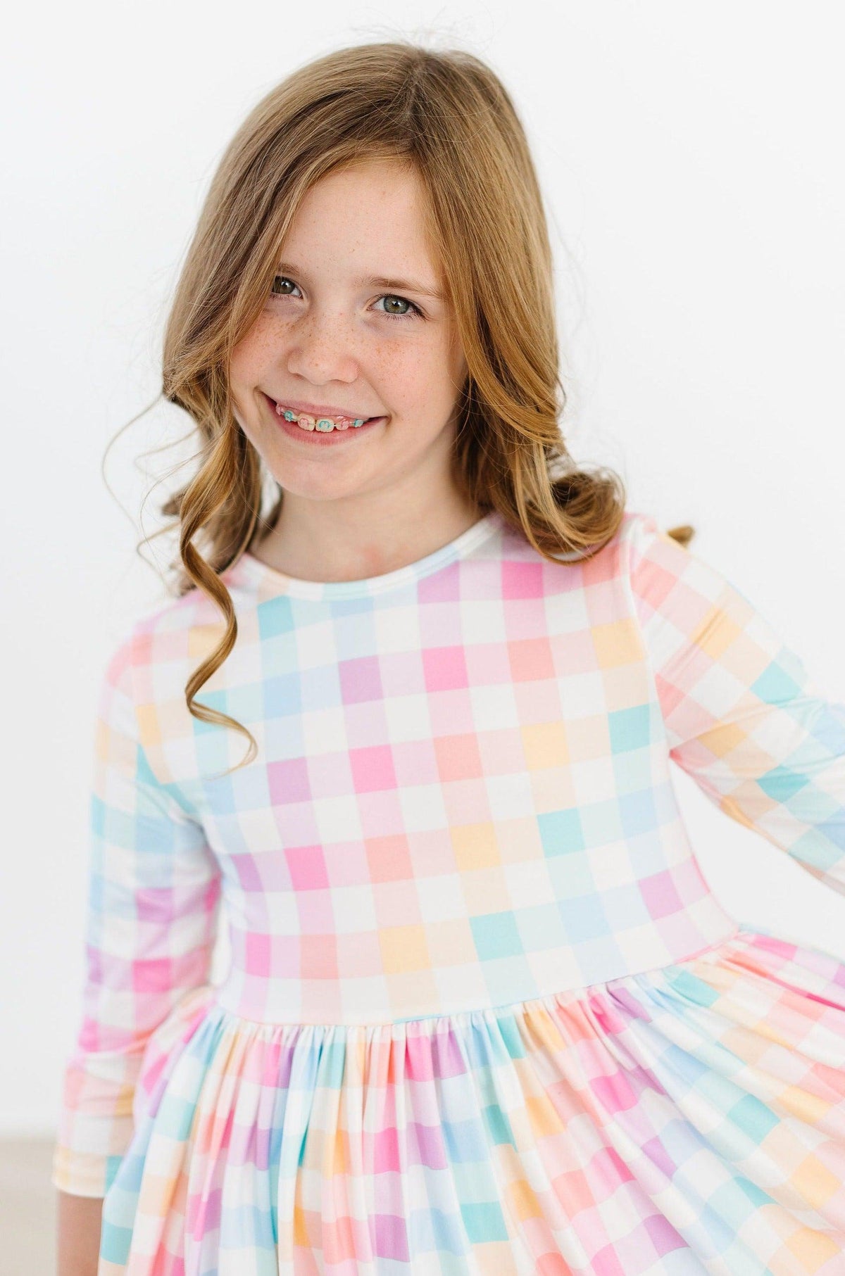 a girl with braces smiling