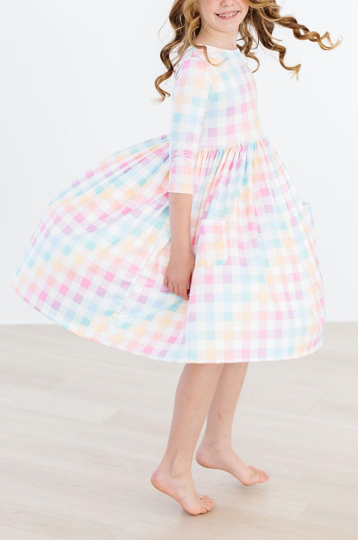 a girl in a plaid dress
