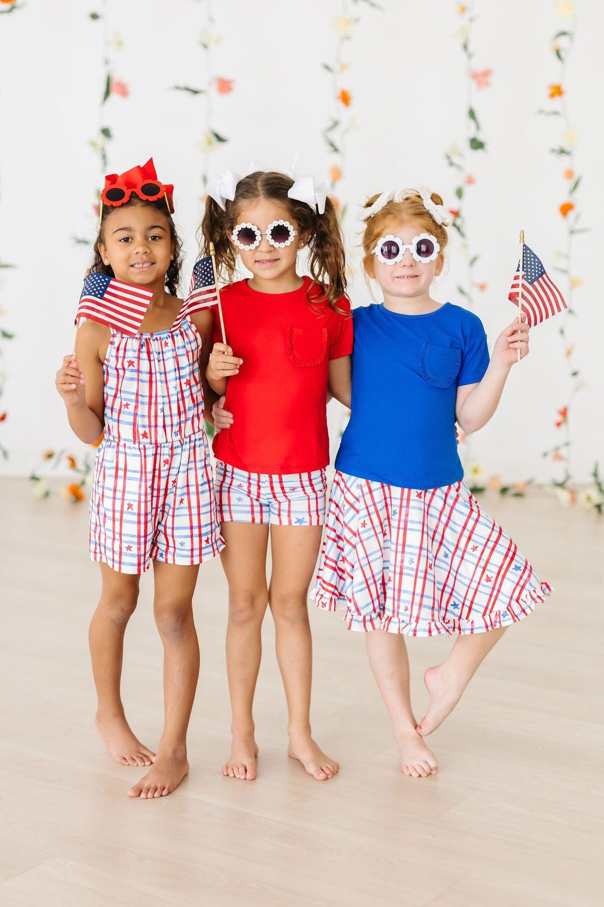 a group of girls holding flags