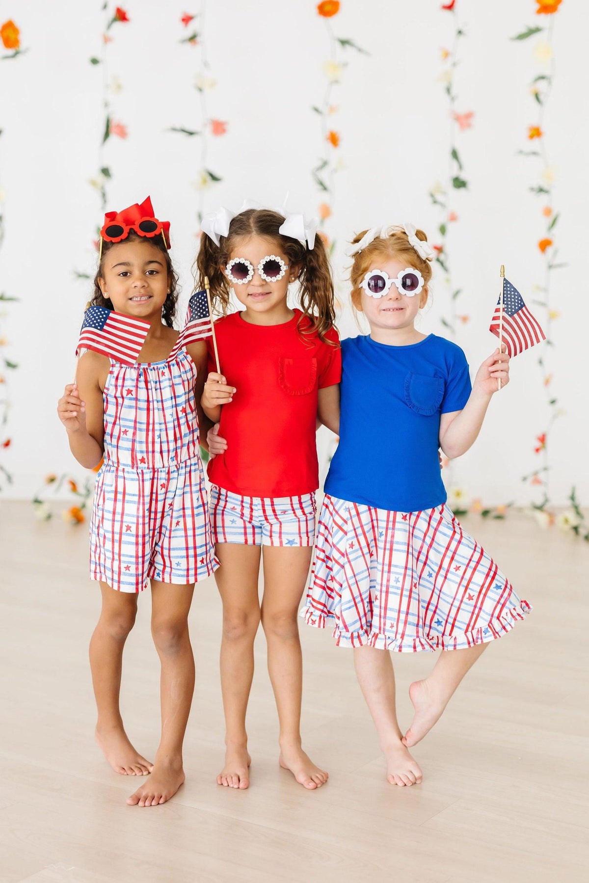 a group of girls holding flags
