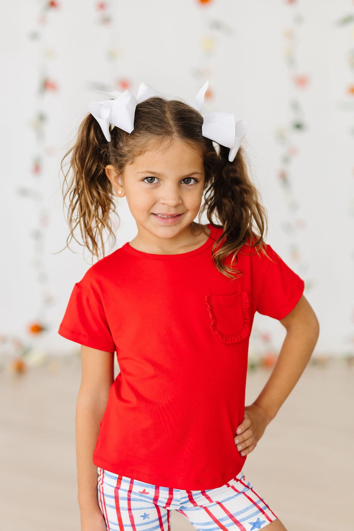 a girl in a red shirt