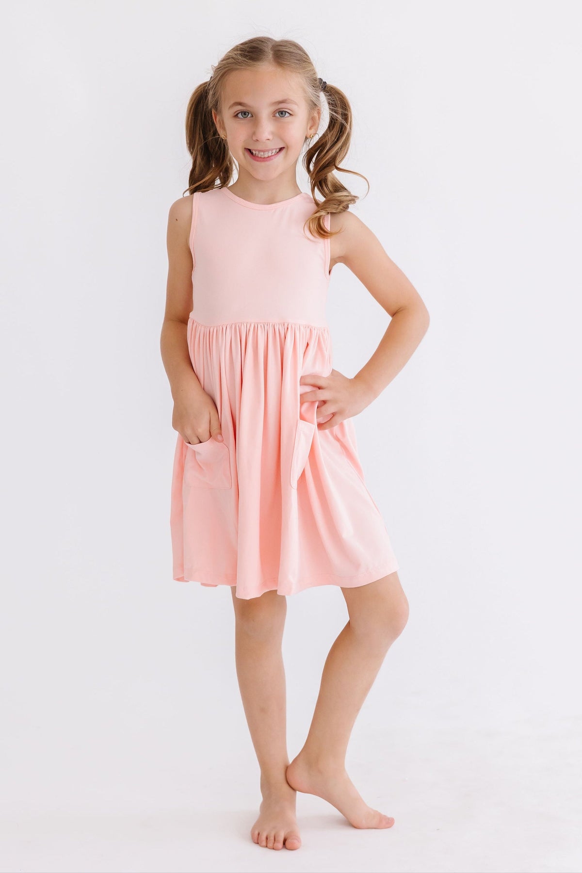 a girl in a pink dress