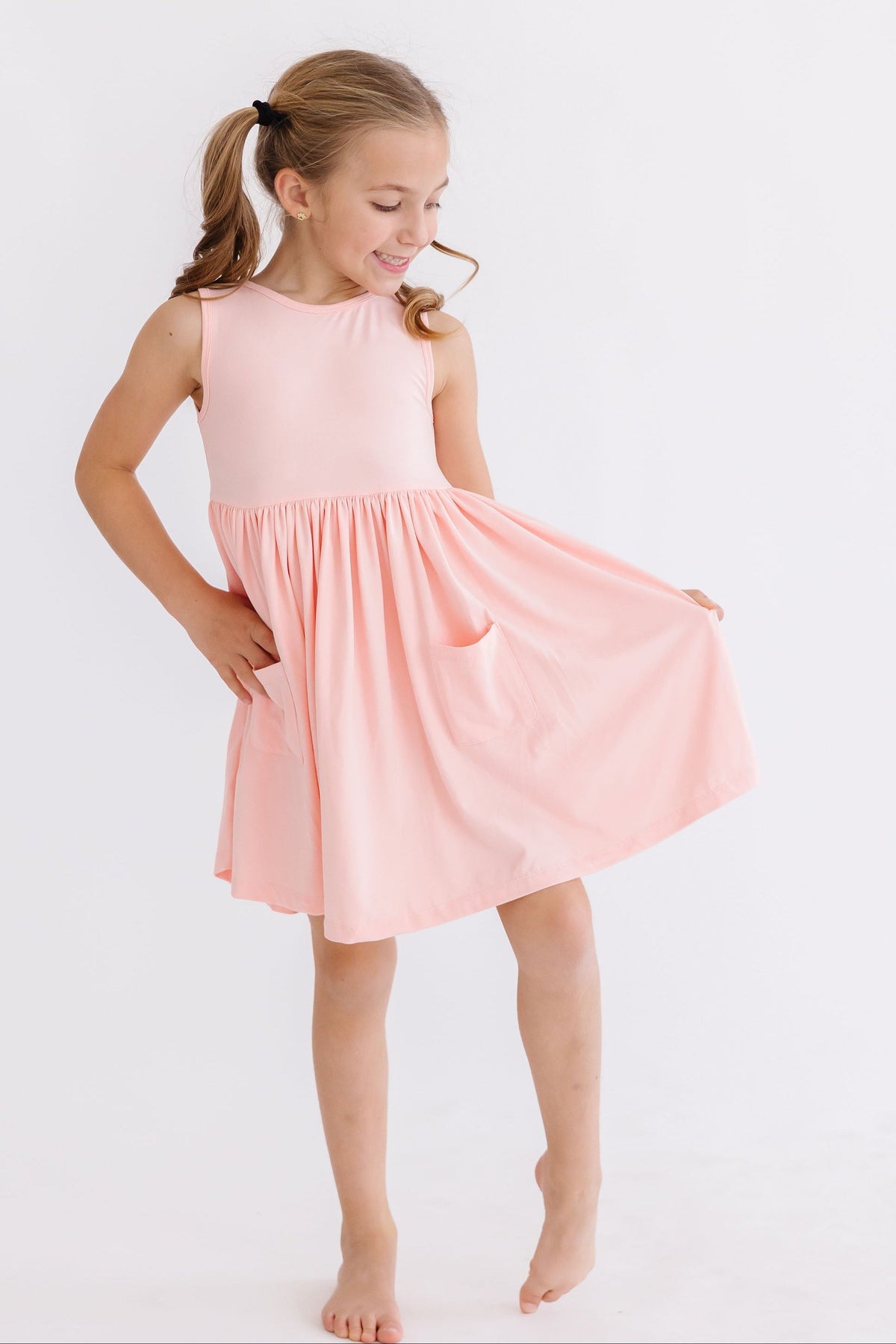 a girl in a pink dress