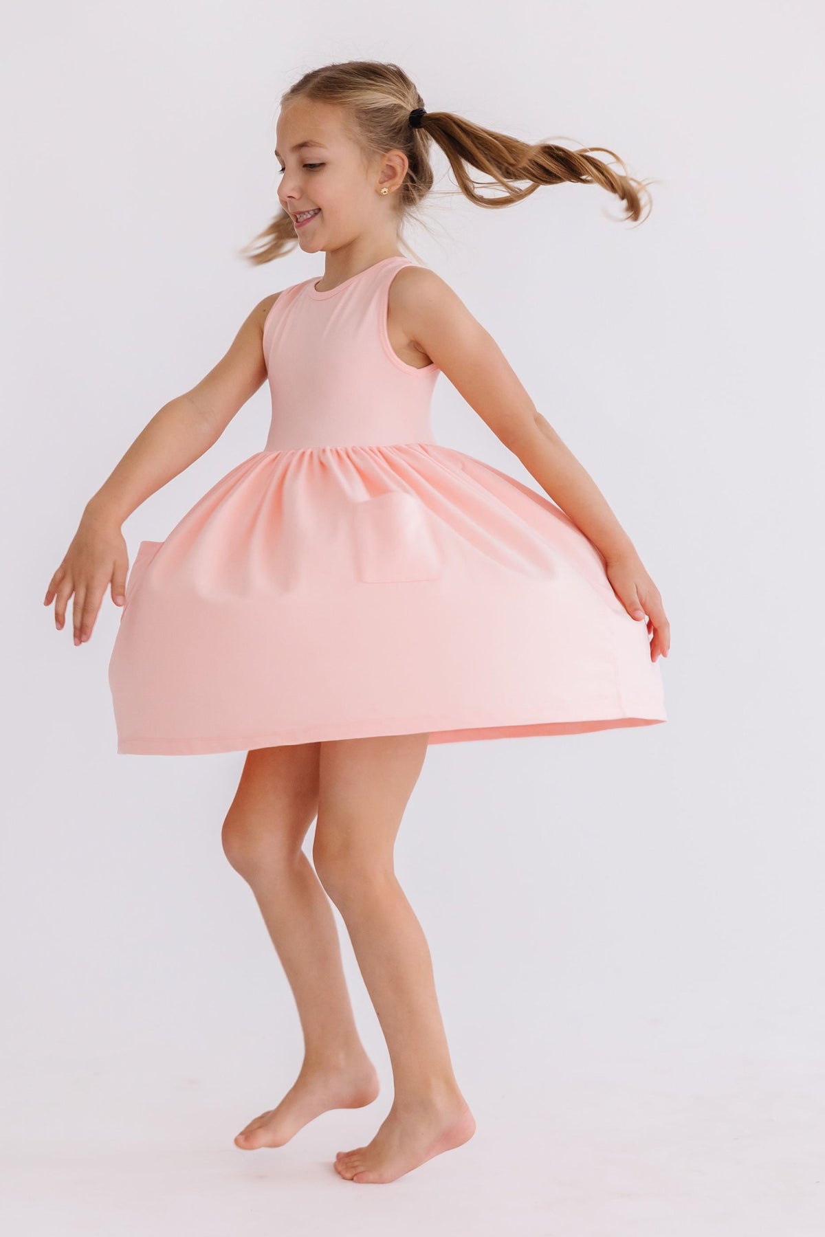 a girl in a pink dress