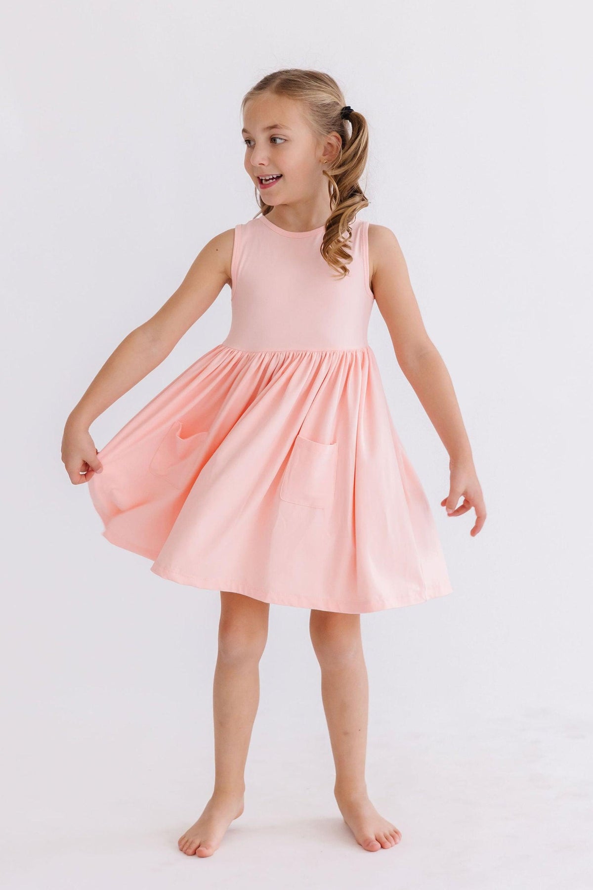 a girl in a pink dress