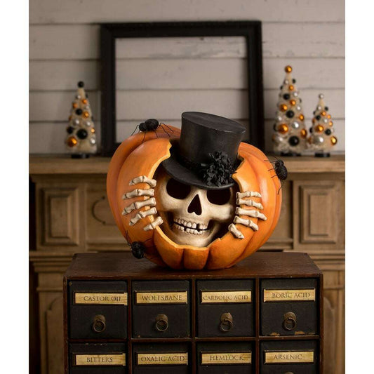 a pumpkin with a skull inside