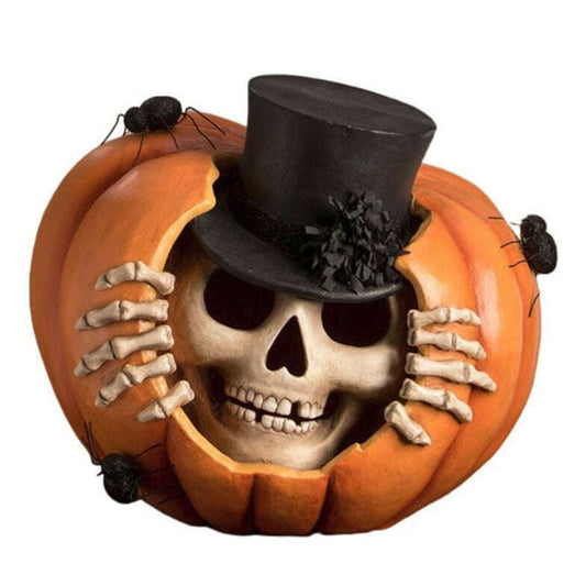 a skull in a pumpkin with a top hat
