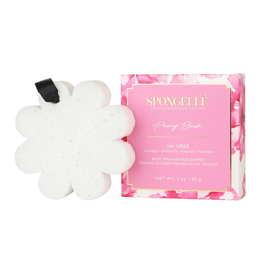 a white sponge next to a pink box