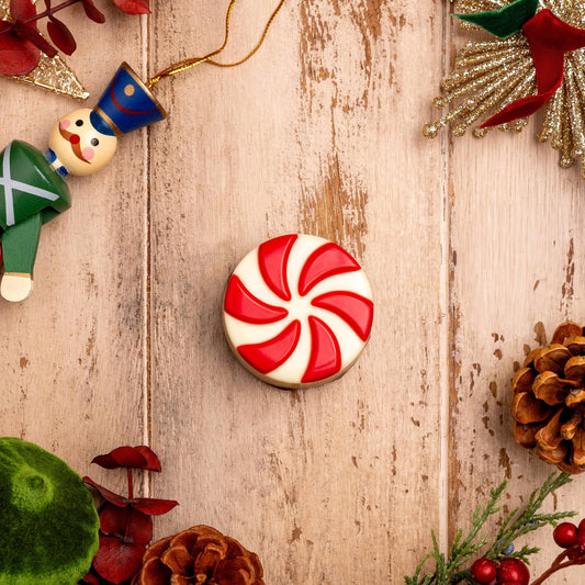 a christmas decoration on a wood surface