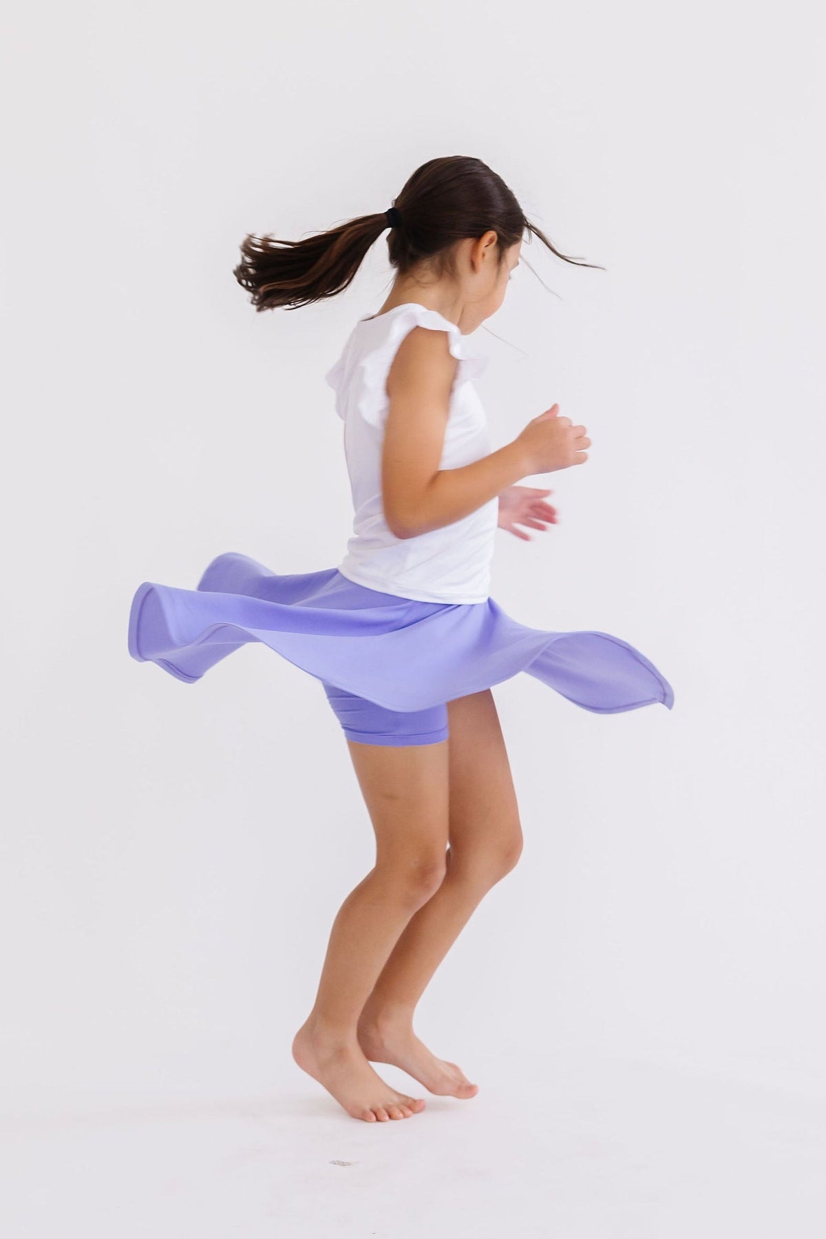 a girl in a purple skirt