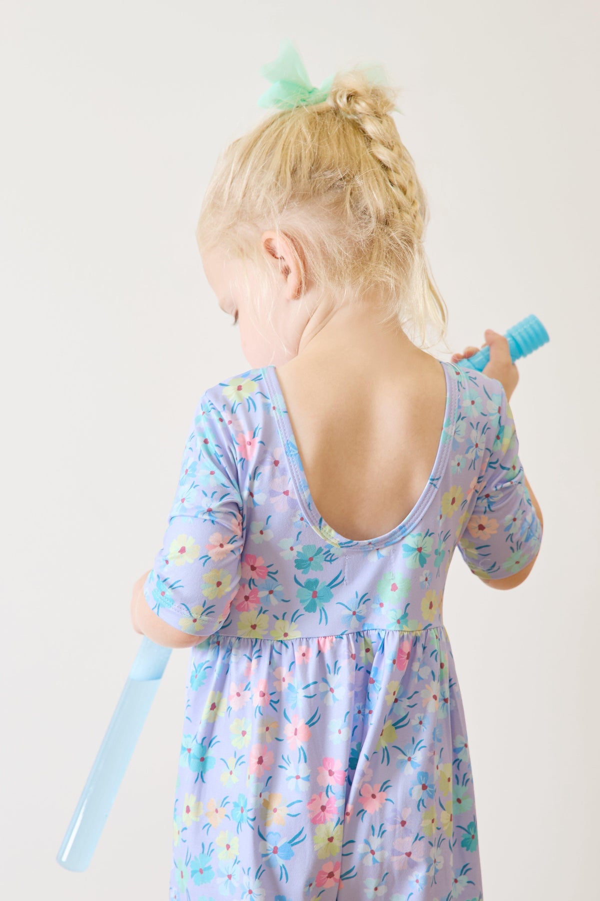 a girl holding a tube