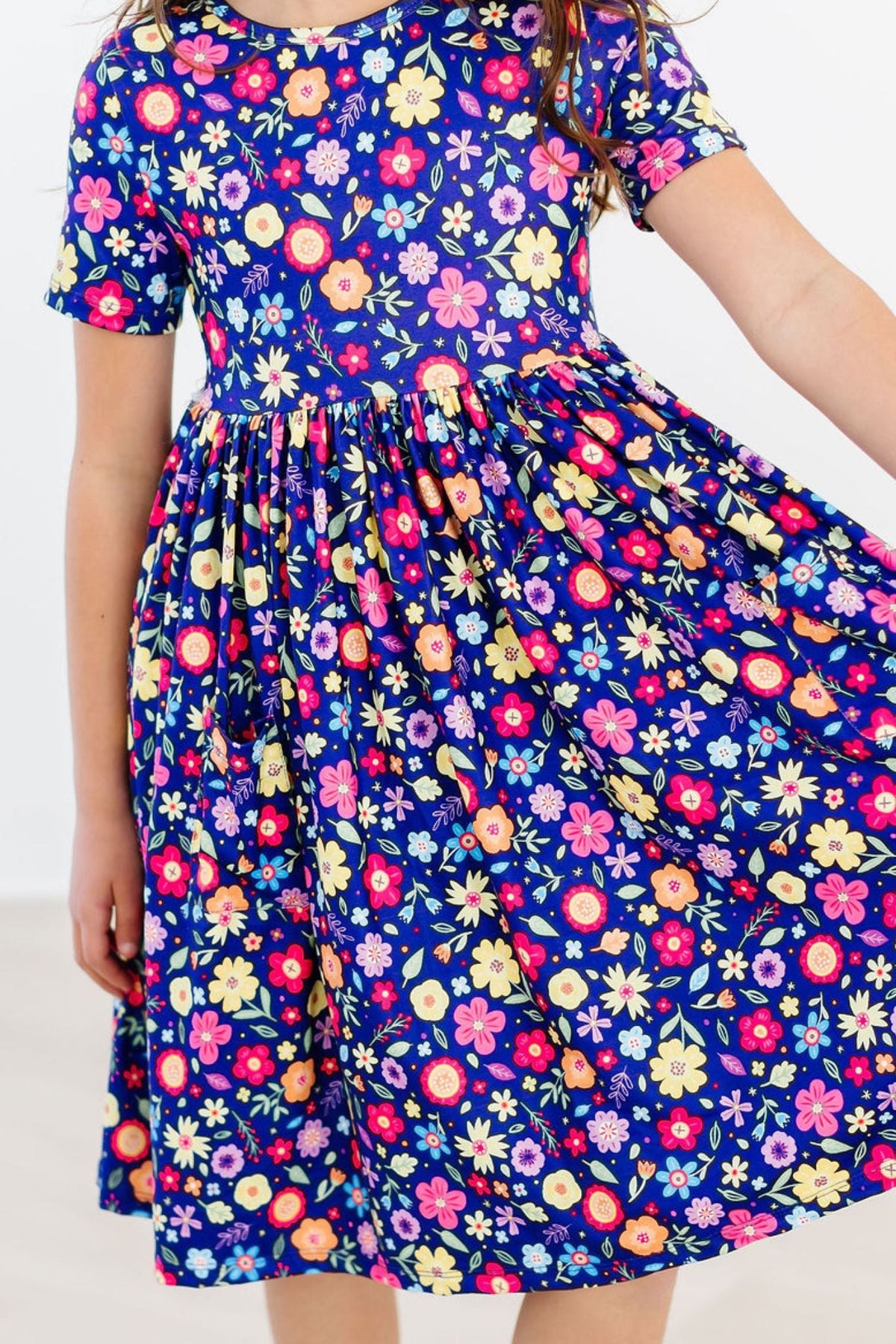 a girl wearing a floral dress