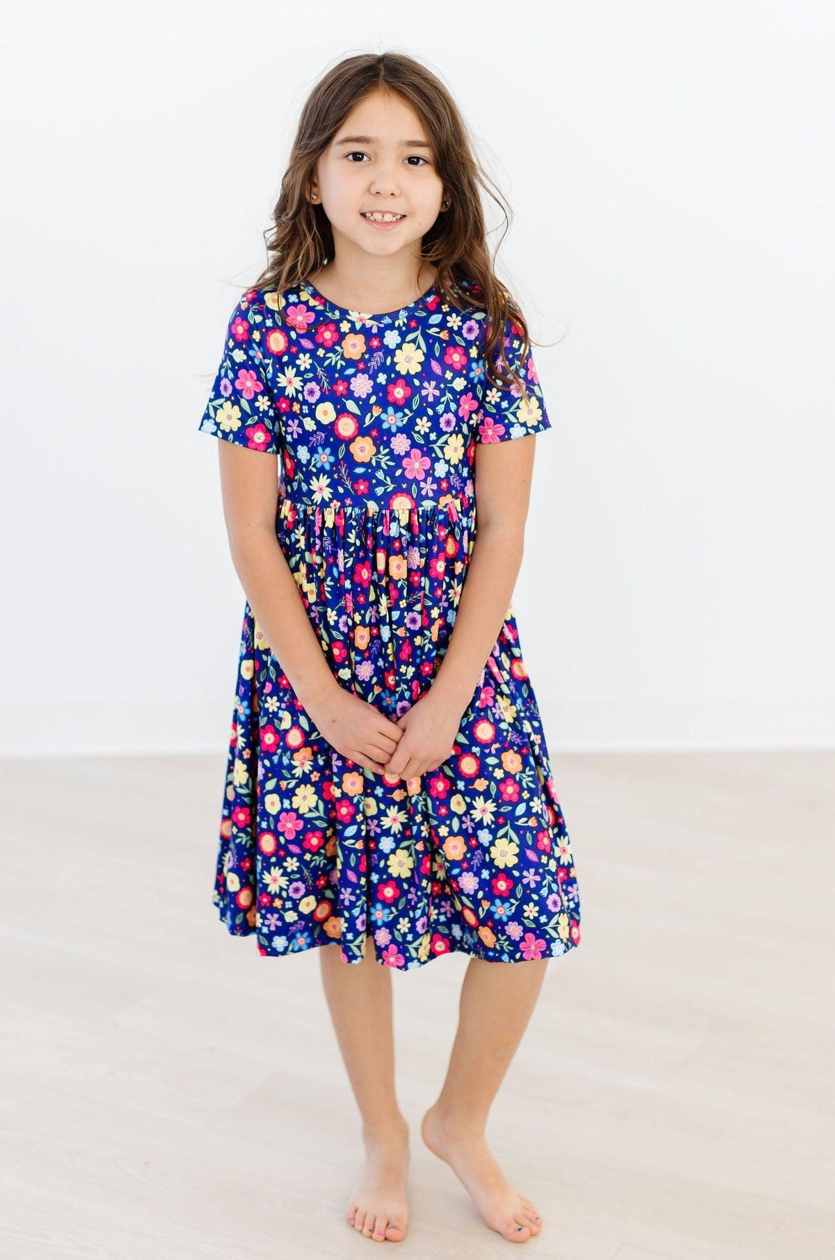a girl in a blue dress