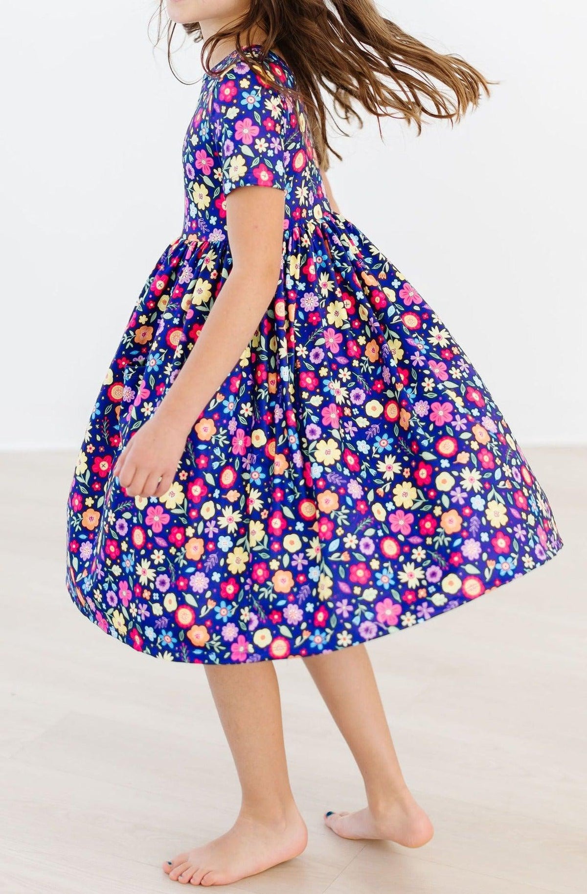 a girl wearing a floral dress