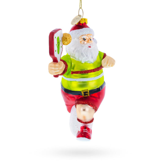 a christmas ornament with a santa claus running