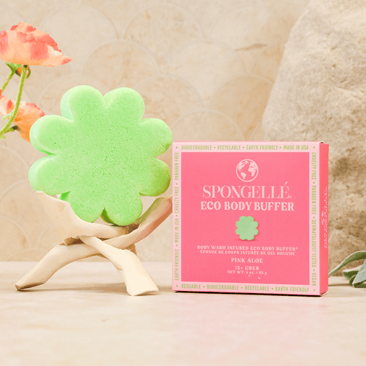 a sponge in a box next to a pink box