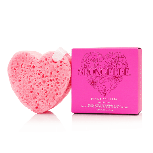 a pink heart shaped sponge next to a pink box