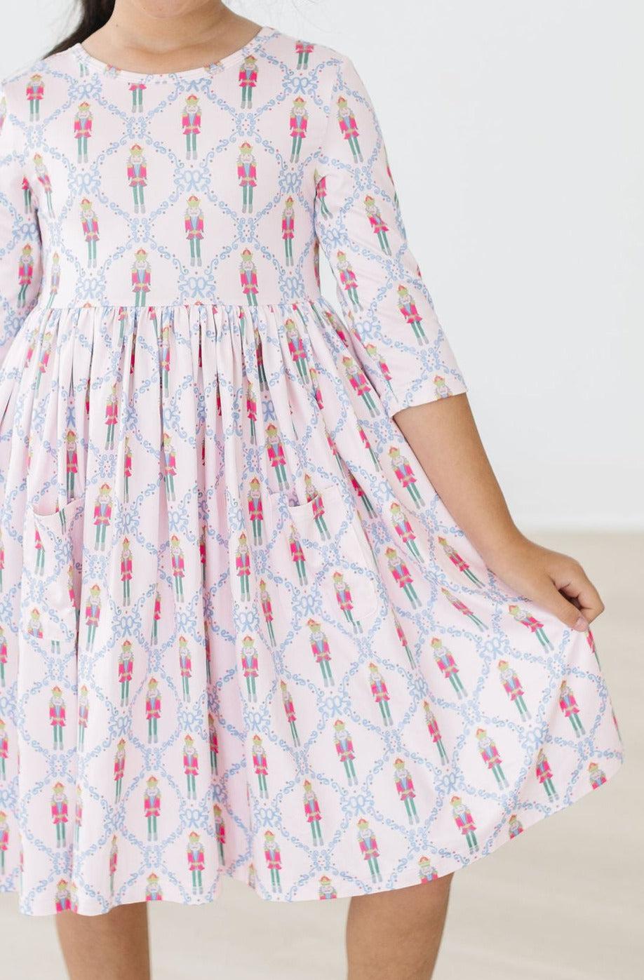a girl wearing a pink dress
