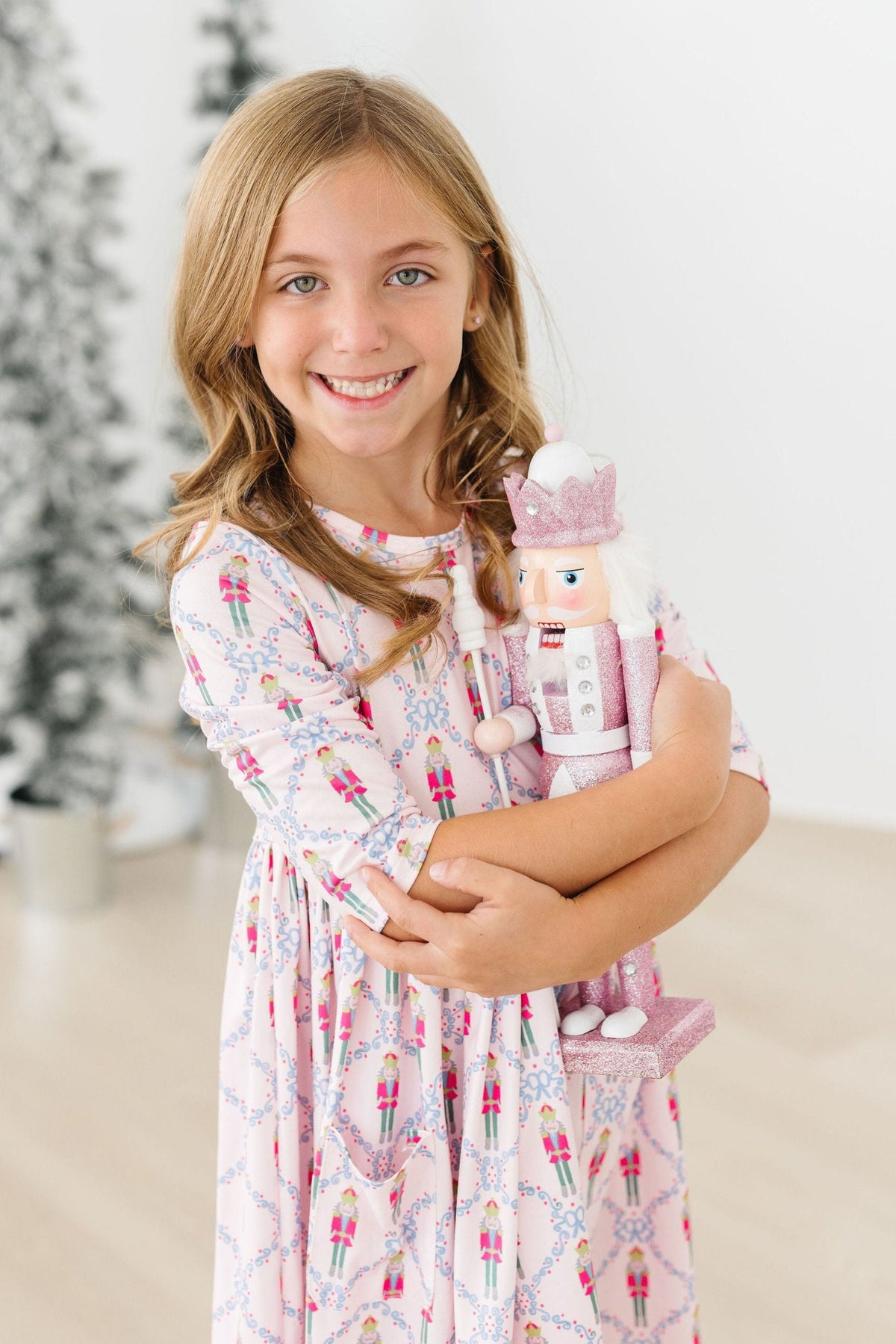 a girl holding a nutcracker