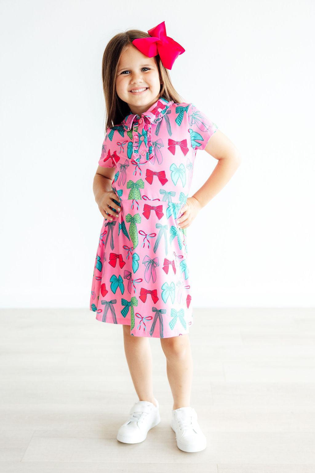 a girl in a pink dress