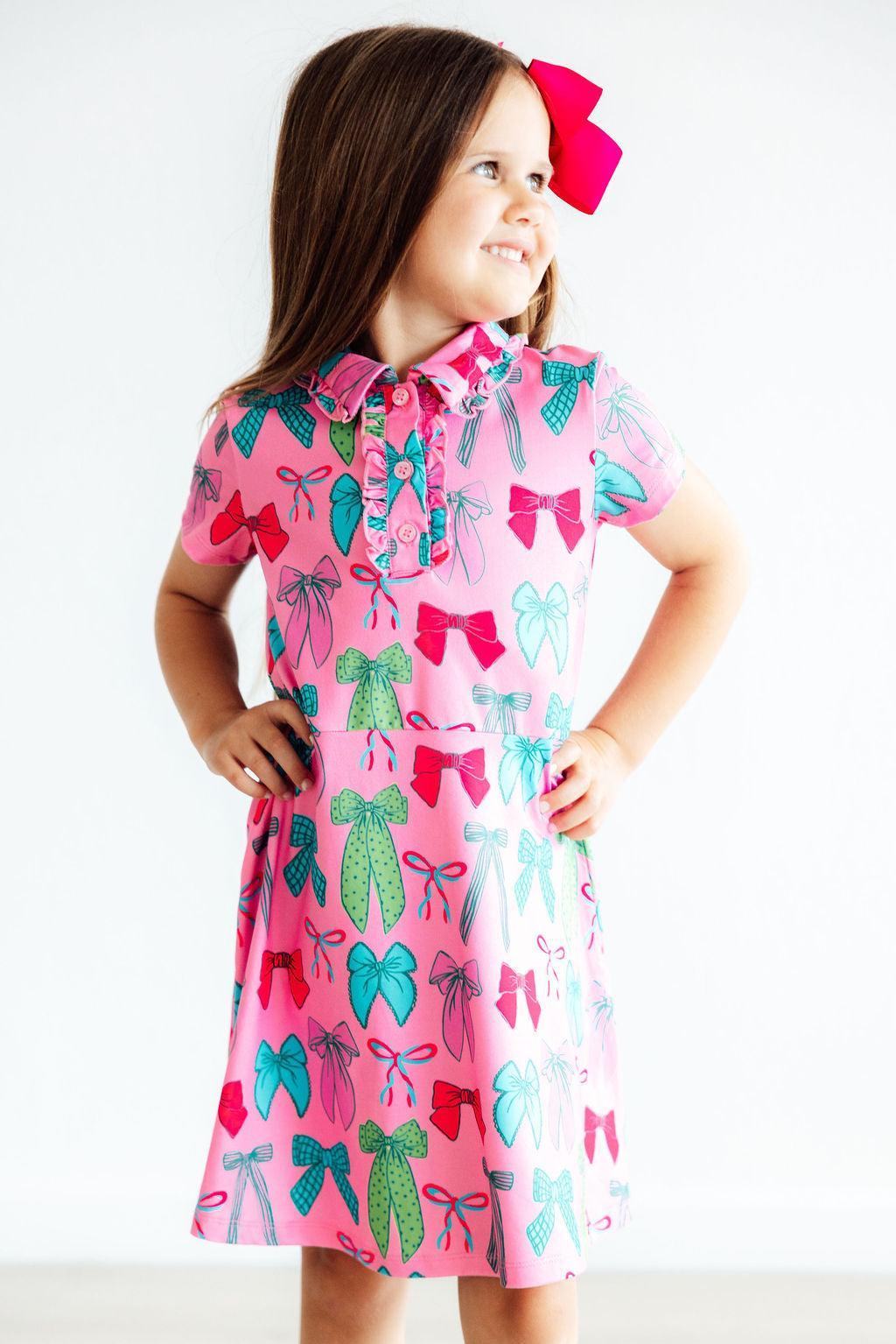 a girl in a pink dress