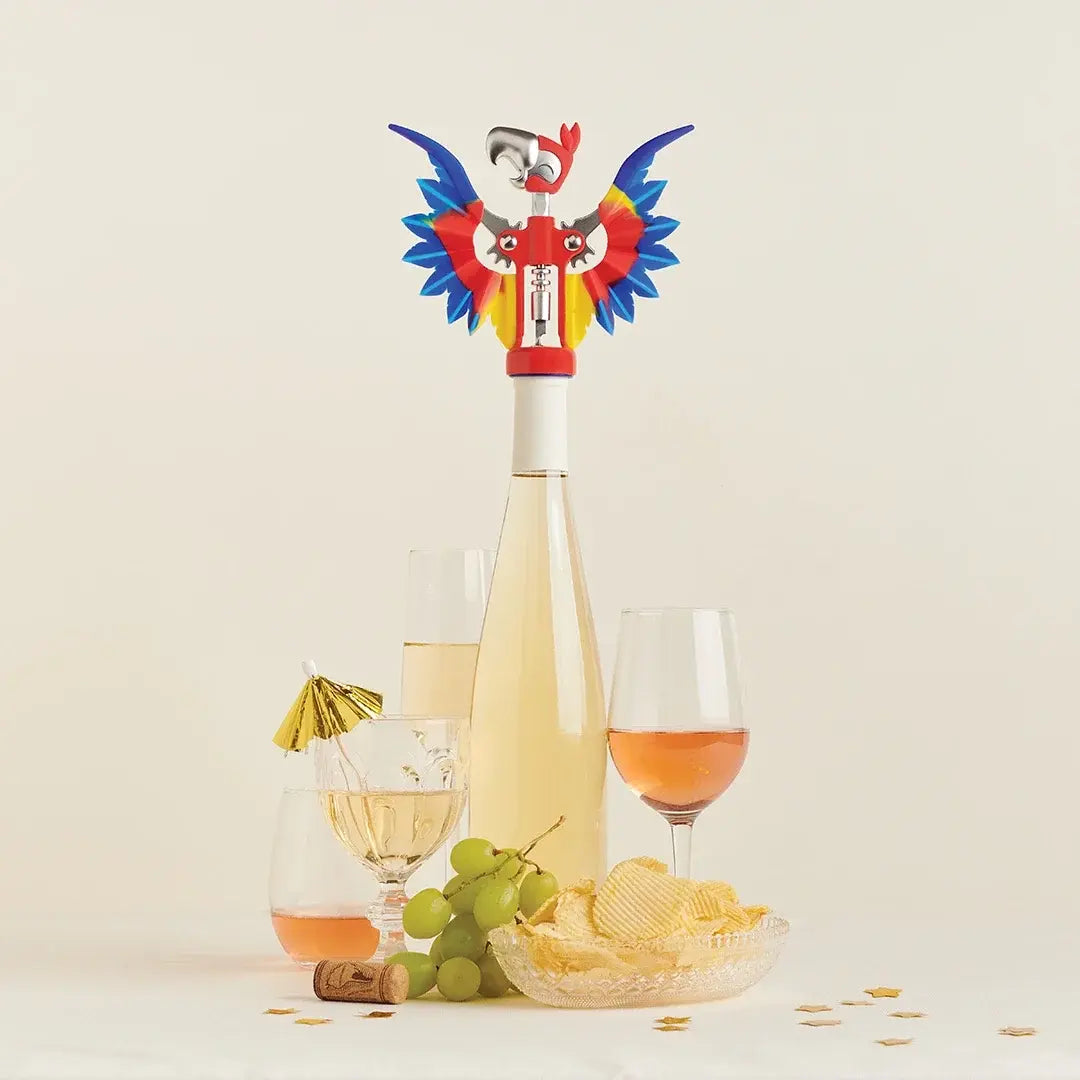 a bottle of wine next to glasses of wine