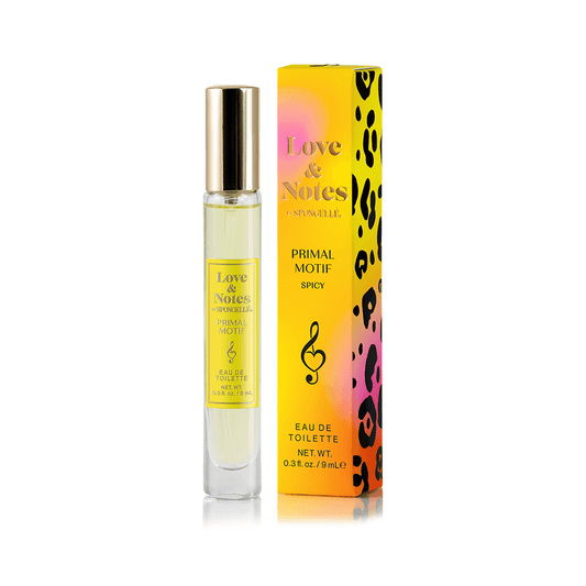 a bottle of perfume next to a box