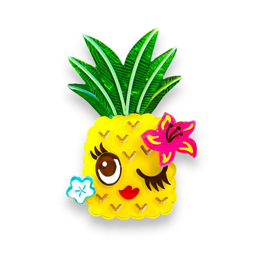 a yellow pineapple with a flower and leaves