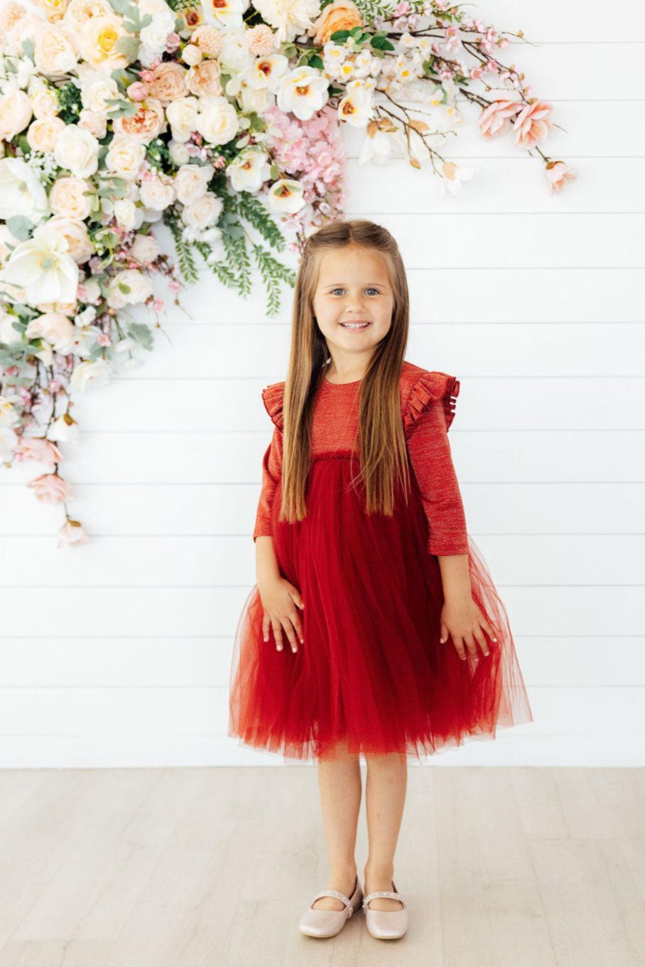 a girl in a red dress