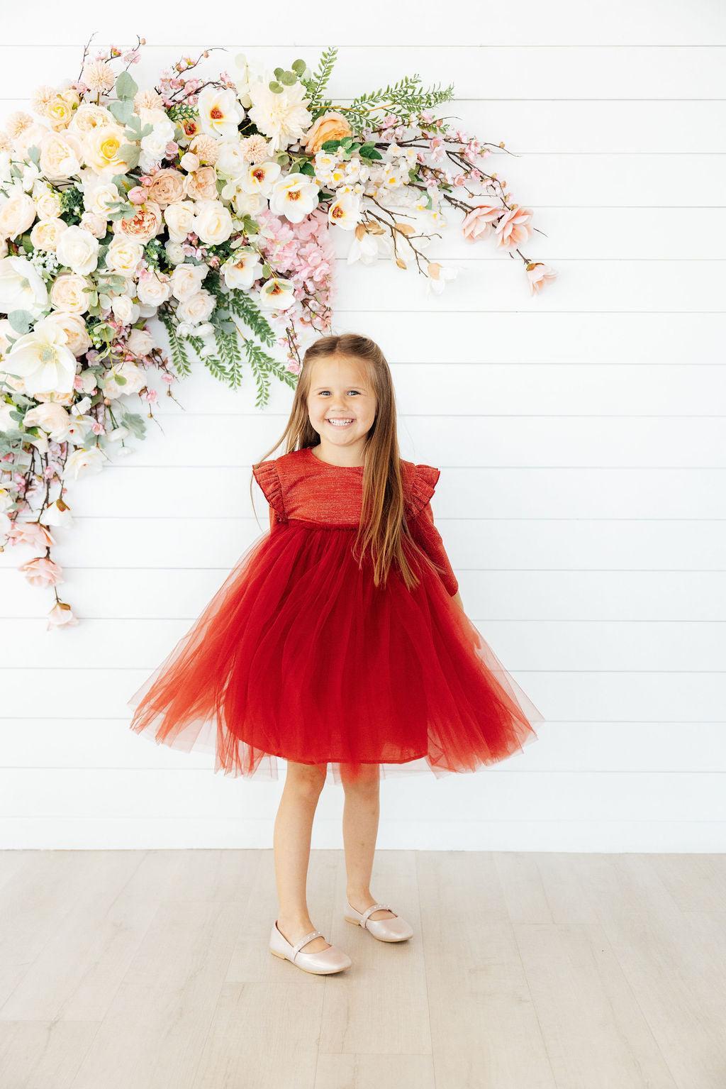 a girl in a red dress