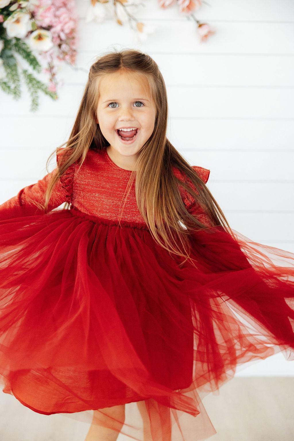 a girl in a red dress
