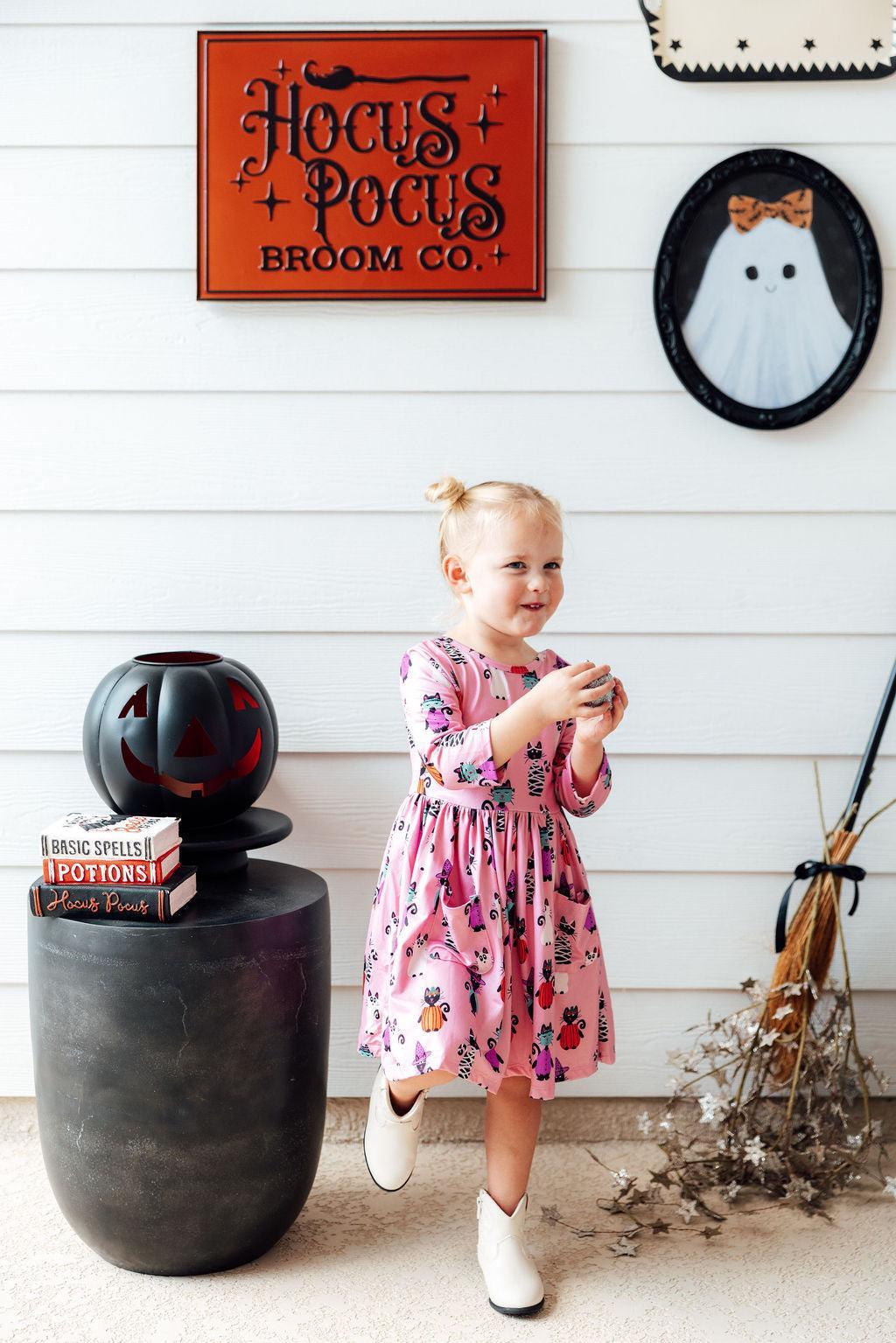 a girl standing in front of a sign